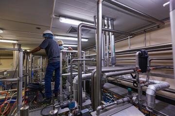 Male worker modern milk cellar stainless steel