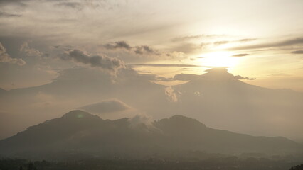 sunrise over the mountains in cloudy weather. This is taken from Famous spot to see sunrise named Mangli Sky View. The place is named 