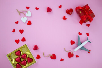 layout on pink background valentine's day. Airplane travel