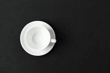 white cup on black