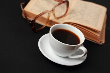 A cup of coffee and a book