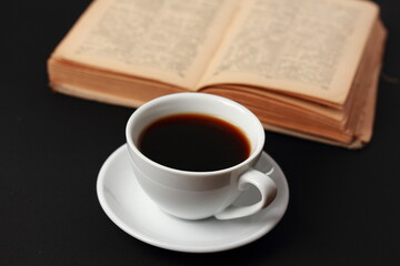 A cup of coffee and a book