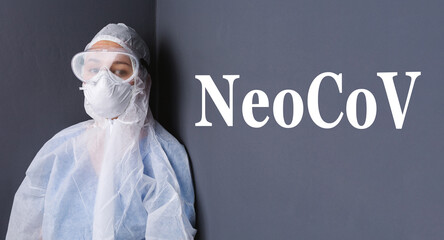 Scientist with protective wears sitting on the dark gray wall where is writing new version of...