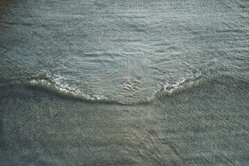 wave on a dark river as part of a waterfall