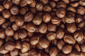 Close up brown hazel nut on wooden desk. Healthy organic vegetarian snack hazelnut. Background