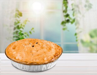 Delicious homemade cake with apple on desk