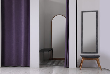 Empty dressing room in fashion store. Stylish interior