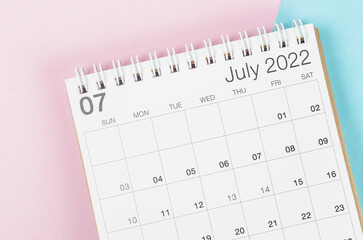July 2022 desk calendar on beautiful background.