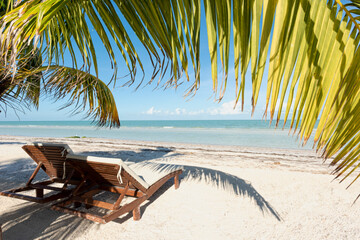 Tropical beach, beach chairs by the sea with white sand, summer vacation concept, vacation design and tourism, exotic landscape