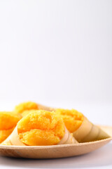 Homemade Toddy palm cake on natural plate with white background, Thai traditional dessert