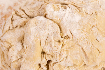 Flour and soft bread dough in bakery, close up, macro, selective focus