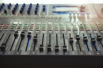 Professional mixing console on table in modern radio studio, closeup