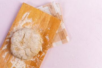 Preparation of the dough with flour on a white background. Free space for text.