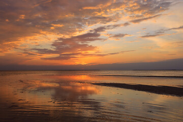 Fototapeta na wymiar Red sunset over sea
