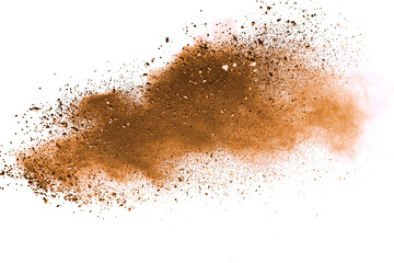 Fototapeta na wymiar Abstract brown powder explosion. Closeup of brown dust particle splash isolated on white background