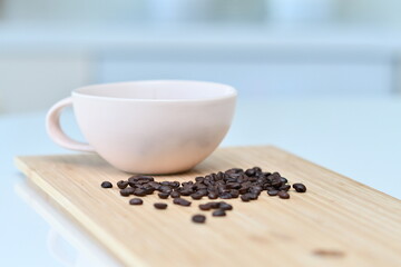 Fototapeta na wymiar Black coffee in a white mug, Coffee beans