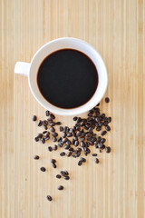 Black coffee in a white mug, Coffee beans
