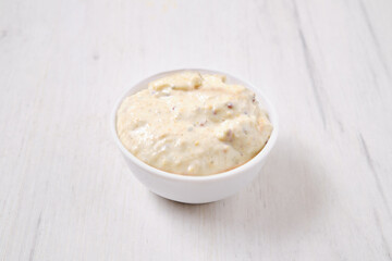 Small bowl with caesar sauce