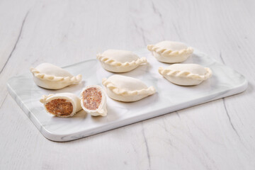 Frozen dumplings stuffed with beef meat and provencal herbs