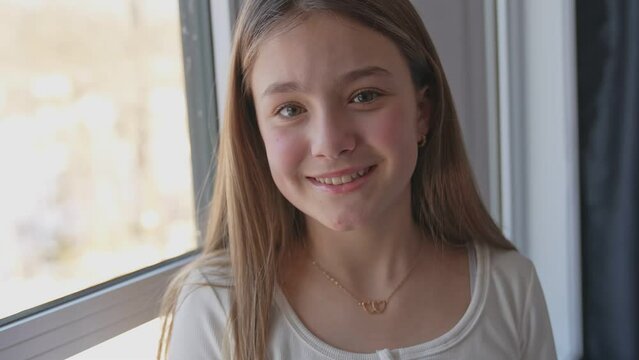 Teen spending time relaxing on bedroom at home	