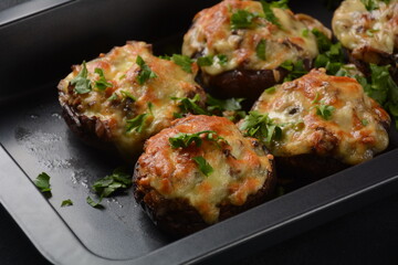 Stuffed mushroom caps with cream cheese, parmesan, garlic and herbs.