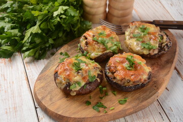 Stuffed mushroom caps with cream cheese, parmesan, garlic and herbs.