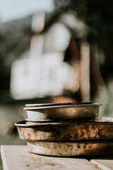 Ingredients for dough making, in old copper bowls and on the old wooden table, rustic style