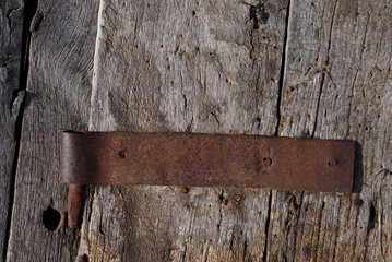 Aging and Weathered Wood with Rusty Hinge.