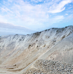Mining and Quarry mining material. Processing plant for crushed stone and gravel. Gravel stone dumps in a quarry open pit mining.