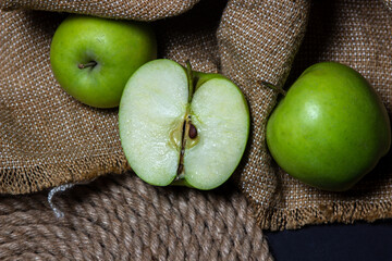Green apples on a dark background. Fruit theme. fruit good for health