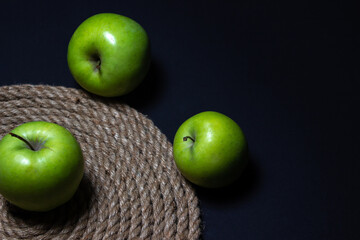Green apples on a dark background. Fruit theme. fruit good for health