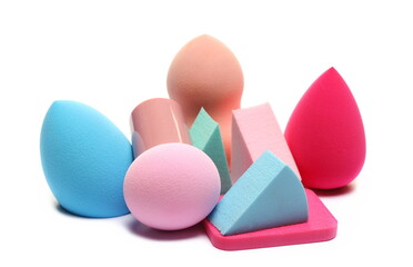 Beauty blender pile, powder puff, colorful cosmetic makeup applicator sponge tools set isolated on white 