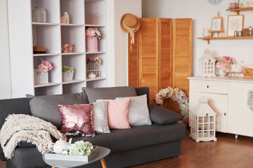 Pink living room. Studio apartment. Loft interior. Shelves and decor in room. Rent and delivery of housing. Hostel and hotel