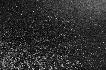 Wall panel grunge black or dark grey concrete background.Backdrop Dirty,dust black wall concrete,cement blackboard texture and splash white color,brush stroke for architecture or abstract background.