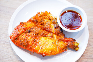 grilled half chicken with spicy sauce