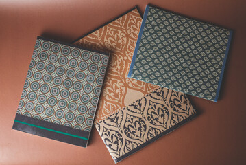 blue and brown notebooks with geometric and oriental ornaments 