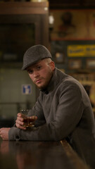 elegant man with glass of whiskey