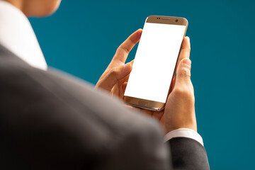 Cropped shot view of business man hands holding smart phone with blank copy space screen