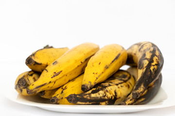 Kerala Ripen Ethapazham Or Plantain Banana In White Plate. Also Known As Nenthra Pazham