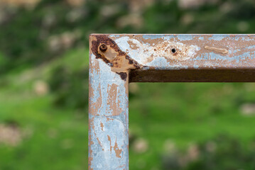 90 degrees angle of a worn rusted metal structure