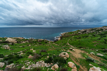 View over the rocks, valleys and local agriculture at the bay of the Mediterranean sea, Selmun, Malta