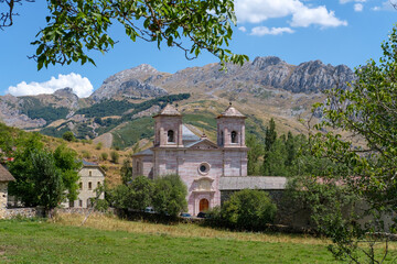 Lois Church Cathedral Mountain, Cremenes Leon, Spain. Veined Red Marble Limestone Facade