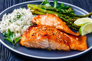 fried salmon fish fillet with rice and asparagus