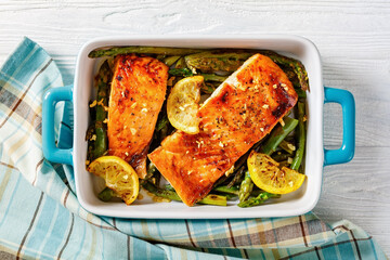baked salmon fish fillet with asparagus and lemon
