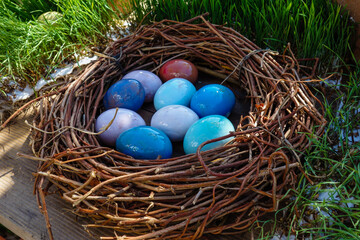 Fototapeta na wymiar color easter eggs in basket isolated on white. High quality photo