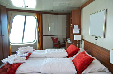 Cozy bedroom living room inside cabin suite stateroom stylish Scandinavian interior design onboard...