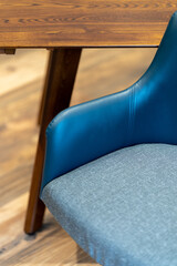 Detail shot of blue leather and fabric chair