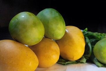 Mangoes, juicy stone fruits, from numerous species of tropical trees belonging to the flowering...