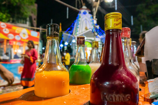 Howrah, West Bengal, India- April 14th 2019 : Colourful juices and syrups for making ice gold or Barf ka gola or chuski or gola ganda, a summer delicacy made of crushed ice, Indian street food.