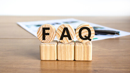 FAQ frequently asked questions symbol. Concept words FAQ frequently asked questions on wooden...